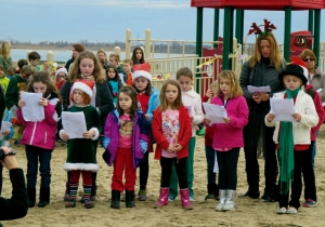 Members of a local Girl Scout and CCD group sang for the crowd.